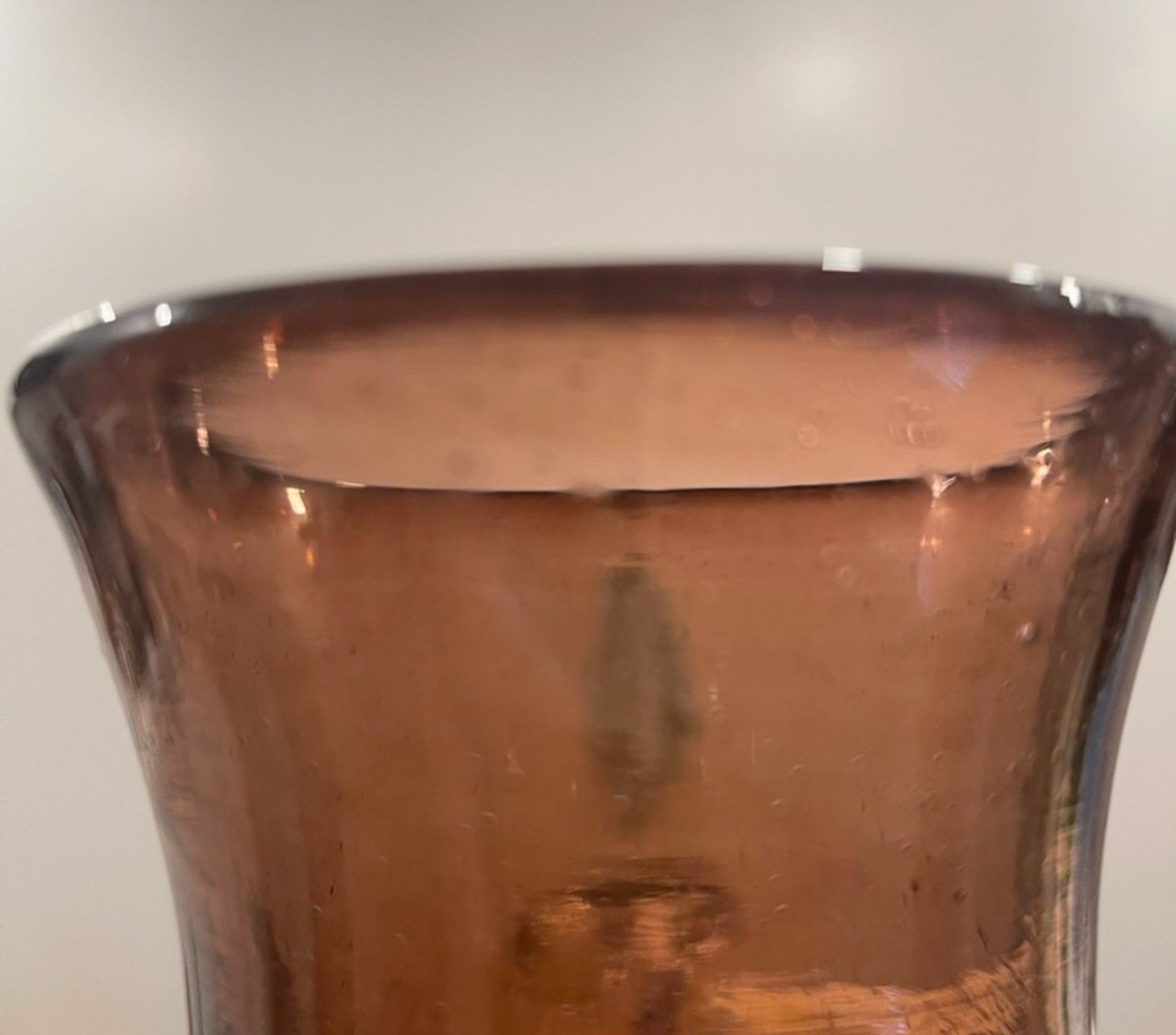 Brown glass vase on a white background